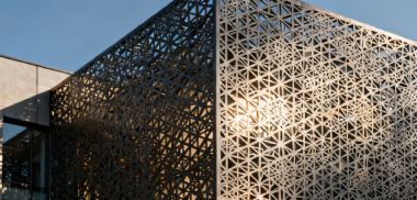 Architectural sheet metal components including cladding panels and decorative metalwork